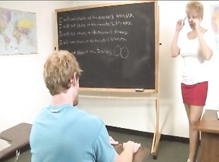 Horny student enjoys while his mature tutor strokes his boner